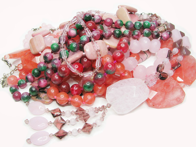 heap of red and pink colored beads