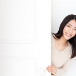 a young asian woman with door