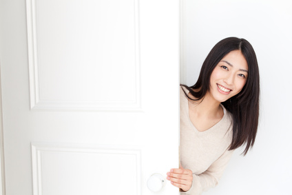 a young asian woman with door